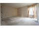 Carpeted bedroom with window and bright natural light at 3611 Owster Ln, Indianapolis, IN 46237