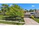 Charming two-story home with mature landscaping, inviting curb appeal, and a two-car garage at 3611 Owster Ln, Indianapolis, IN 46237