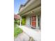 Covered front porch with red door and attractive landscaping at 3611 Owster Ln, Indianapolis, IN 46237