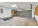 Spacious garage featuring an automatic door and additional metal storage shelving at 3611 Owster Ln, Indianapolis, IN 46237