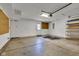 Well-lit garage interior with a door to the exterior and built-in storage at 3611 Owster Ln, Indianapolis, IN 46237