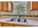 Close-up of kitchen sink with a window view at 3611 Owster Ln, Indianapolis, IN 46237