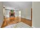 Bright living room boasts hardwood floors, a brick fireplace with built-ins, and plenty of natural light at 3611 Owster Ln, Indianapolis, IN 46237