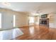 Bright living room boasts hardwood floors, a fireplace, and an abundance of natural light at 3611 Owster Ln, Indianapolis, IN 46237