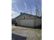 Detached two car garage with ample parking and a basketball hoop at 369 Northfield Dr, Mooresville, IN 46158