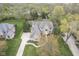 A bird's-eye view showcasing the home's architectural design and meticulously landscaped grounds at 3837 Penzance Pl, Carmel, IN 46032