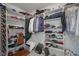 Walk-in closet with ample shelving and hanging space for organized storage at 3837 Penzance Pl, Carmel, IN 46032