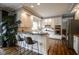 Bright kitchen featuring white cabinets, stainless steel appliances, and a breakfast bar with seating at 3837 Penzance Pl, Carmel, IN 46032