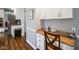 The kitchen with stainless steel appliances and a cozy breakfast nook at 3837 Penzance Pl, Carmel, IN 46032