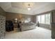 Relaxing main bedroom with tray ceiling, plush carpet, and lots of natural light at 3837 Penzance Pl, Carmel, IN 46032