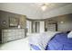 Serene main bedroom with stylish furnishings and neutral decor with a large window at 3837 Penzance Pl, Carmel, IN 46032