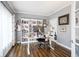Bright office space with built-in bookshelves, natural light, and modern desk setup at 3837 Penzance Pl, Carmel, IN 46032