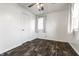 A bright bedroom with a single window and modern flooring at 3909 Aloda St, Indianapolis, IN 46203