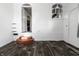 Bright living room featuring a window, wood-look floors, and an arched doorway to an adjacent room at 3909 Aloda St, Indianapolis, IN 46203