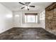 Inviting living room showcases stylish flooring, a stone accent wall, and natural light at 3909 Aloda St, Indianapolis, IN 46203