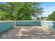 Spacious back deck great for outdoor lounging and activities features a wooden deck with green fencing at 401 Sanders St, Indianapolis, IN 46225