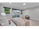 Bright bedroom with a large sliding glass door leading to a private balcony at 401 Sanders St, Indianapolis, IN 46225