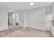 Spacious bedroom featuring soft carpet, neutral walls, and natural light from a side window at 401 Sanders St, Indianapolis, IN 46225