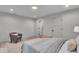 Serene bedroom featuring soft carpet, modern lighting, and a comfortable reading chair at 401 Sanders St, Indianapolis, IN 46225