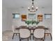 Elegant dining area with modern decor, featuring a wooden table and stylish chandelier at 401 Sanders St, Indianapolis, IN 46225