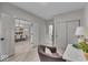 Inviting home office featuring sliding closet doors, hardwood floors, and views into the dining room at 401 Sanders St, Indianapolis, IN 46225