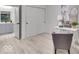 Bright home office with gray walls, hardwood floors, and a functional desk space next to sliding closet doors at 401 Sanders St, Indianapolis, IN 46225