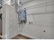 Utility room features a tankless hot water heater and wire rack shelving for storage solutions at 401 Sanders St, Indianapolis, IN 46225