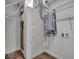 The utility room features a tankless hot water heater, wire rack shelves, and washer/dryer hookups at 401 Sanders St, Indianapolis, IN 46225