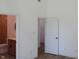 Neutral bedroom with fresh white paint, new flooring and baseboards, and access to a bathroom at 4230 Kingsley Dr, Indianapolis, IN 46205