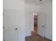 Bright bedroom with hardwood floors, white walls, and natural light at 4230 Kingsley Dr, Indianapolis, IN 46205