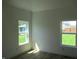 Bright bedroom with fresh white paint, new flooring, baseboards, and bright windows with green views at 4230 Kingsley Dr, Indianapolis, IN 46205