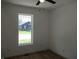 Bright bedroom with hardwood floors, white walls, and natural light at 4230 Kingsley Dr, Indianapolis, IN 46205