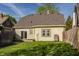 Exterior of home showcasing brown shingles, siding and sliding glass door leading to deck at 4247 Central Ave, Indianapolis, IN 46205