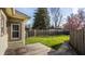 Expansive backyard featuring a deck, privacy fence, and lush green grass at 4247 Central Ave, Indianapolis, IN 46205