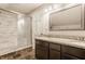 Modern bathroom features a glass shower and granite countertops, offering a spa-like experience at 4247 Central Ave, Indianapolis, IN 46205