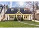 Charming home featuring lovely landscaping and inviting front porch area at 4247 Central Ave, Indianapolis, IN 46205