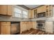 Kitchen featuring stainless steel appliances, light wood cabinets and backsplash at 4247 Central Ave, Indianapolis, IN 46205