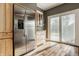 Bright kitchen with stainless steel refrigerator and light wood cabinets at 4247 Central Ave, Indianapolis, IN 46205
