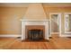 Bright living room featuring a classic fireplace, hardwood floors, and neutral decor at 4247 Central Ave, Indianapolis, IN 46205