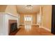 Spacious living room features a fireplace and hardwood floors at 4247 Central Ave, Indianapolis, IN 46205