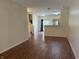 View of an open-concept floor plan with kitchen, living, and dining areas connected by sleek, modern flooring at 4932 Tuscany Ln, Indianapolis, IN 46254