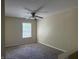 Neutral bedroom featuring a ceiling fan, neutral carpet, and a window offering natural light at 4932 Tuscany Ln, Indianapolis, IN 46254