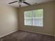 Neutral bedroom featuring a ceiling fan, neutral carpet, and a window offering natural light at 4932 Tuscany Ln, Indianapolis, IN 46254