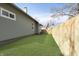 Backyard featuring a new wood fence and well-maintained lawn at 5074 E Walnut St, Indianapolis, IN 46201
