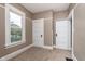 Bedroom with two closets and a window letting in plenty of natural light at 5074 E Walnut St, Indianapolis, IN 46201