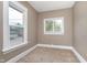 A charming bedroom featuring two windows and plush carpeting at 5074 E Walnut St, Indianapolis, IN 46201