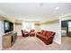 Finished basement with a TV, leather sofa set, and view of the bedroom at 5196 E County Road 100 S, Avon, IN 46123