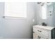 Bathroom with a white vanity, modern fixtures, and a large mirror at 5196 E County Road 100 S, Avon, IN 46123
