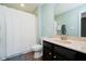 Bathroom featuring a shower with curtain, modern toilet, and a vanity with a sink and mirror at 5196 E County Road 100 S, Avon, IN 46123
