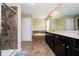 Bathroom with a walk-in shower, a soaking tub, and dual vanities at 5196 E County Road 100 S, Avon, IN 46123